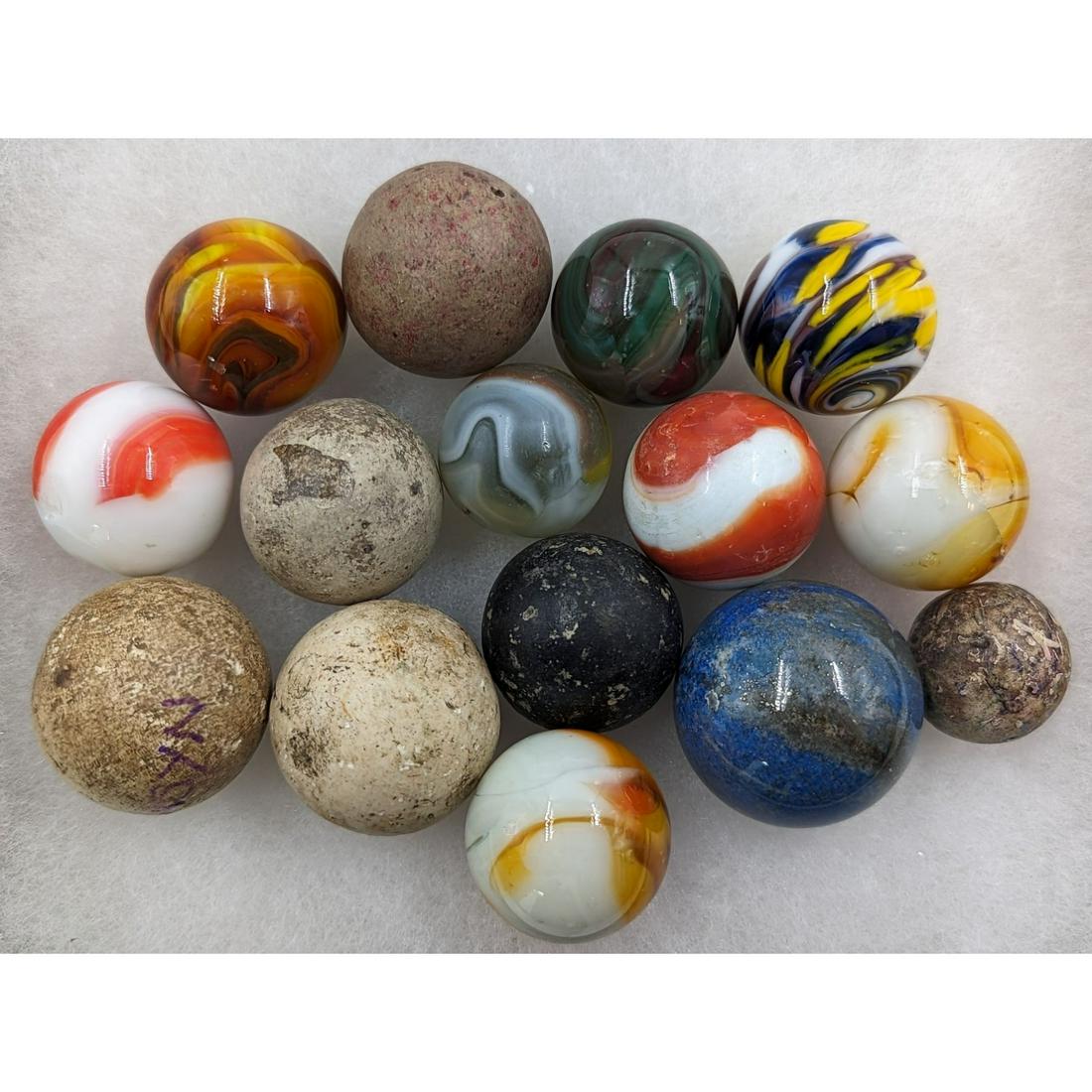 Grouping Of 15 Vintage Marbles: Grouping Of 15 Vintage Marbles. Please carefully read our terms of sale, shipping information, and request any condition reports or photos prior to placing a bid. Any condition statement is given as a