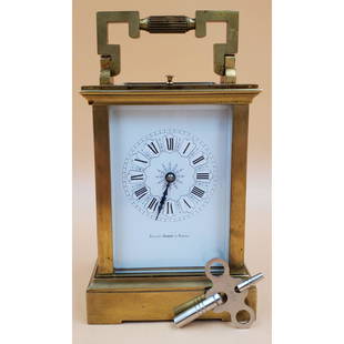 Bailey Banks & Biddle Carriage Clock: Bailey Banks & Biddle Carriage Clock. Measures 4" x 3 1/2" x 6 1/4". Please carefully read our terms of sale, shipping information, and request any condition reports or photos prior to placing a bid.