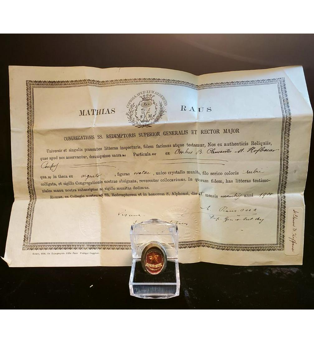 1st class relic of Blessed Clement Hoffbauer with authentication document: 1st class relic of Blessed Clement Hoffbauer with authentication document. The relic is ex. Ossibus (bone), and contained in a silver oval theca. The theca is housed in an acrylic Gothic type presenta