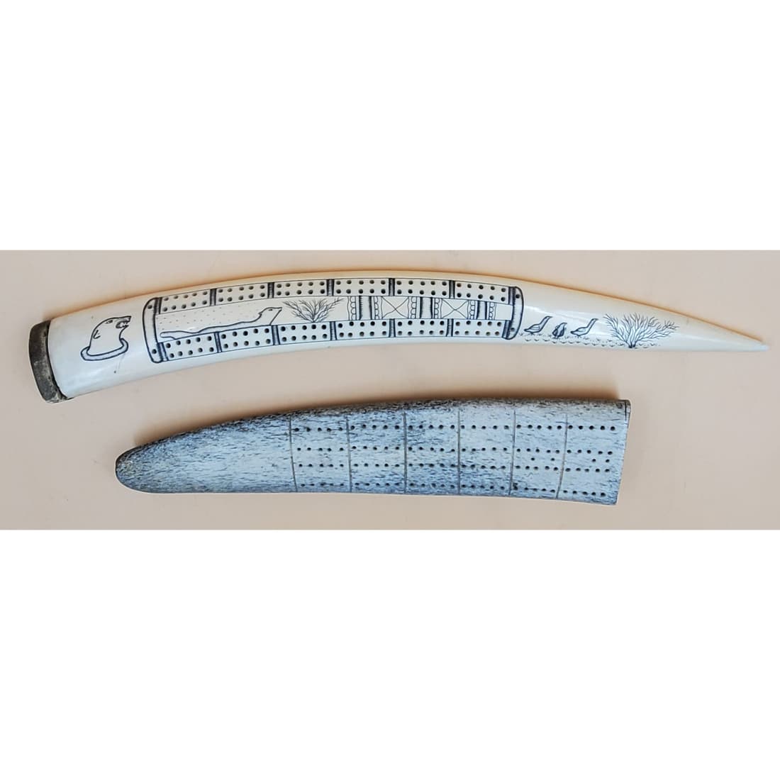 Pair of Inuit Finely Carved Bone Cribbage Boards: Pair of Inuit Finely Carved Bone Cribbage Boards. One measures 16 5/8"x 1 3/4" x 1 1/2", and the other measures12 1/8" x 2 7/8" x 1 1/4" Please carefully read our terms of sale, shipping information, 