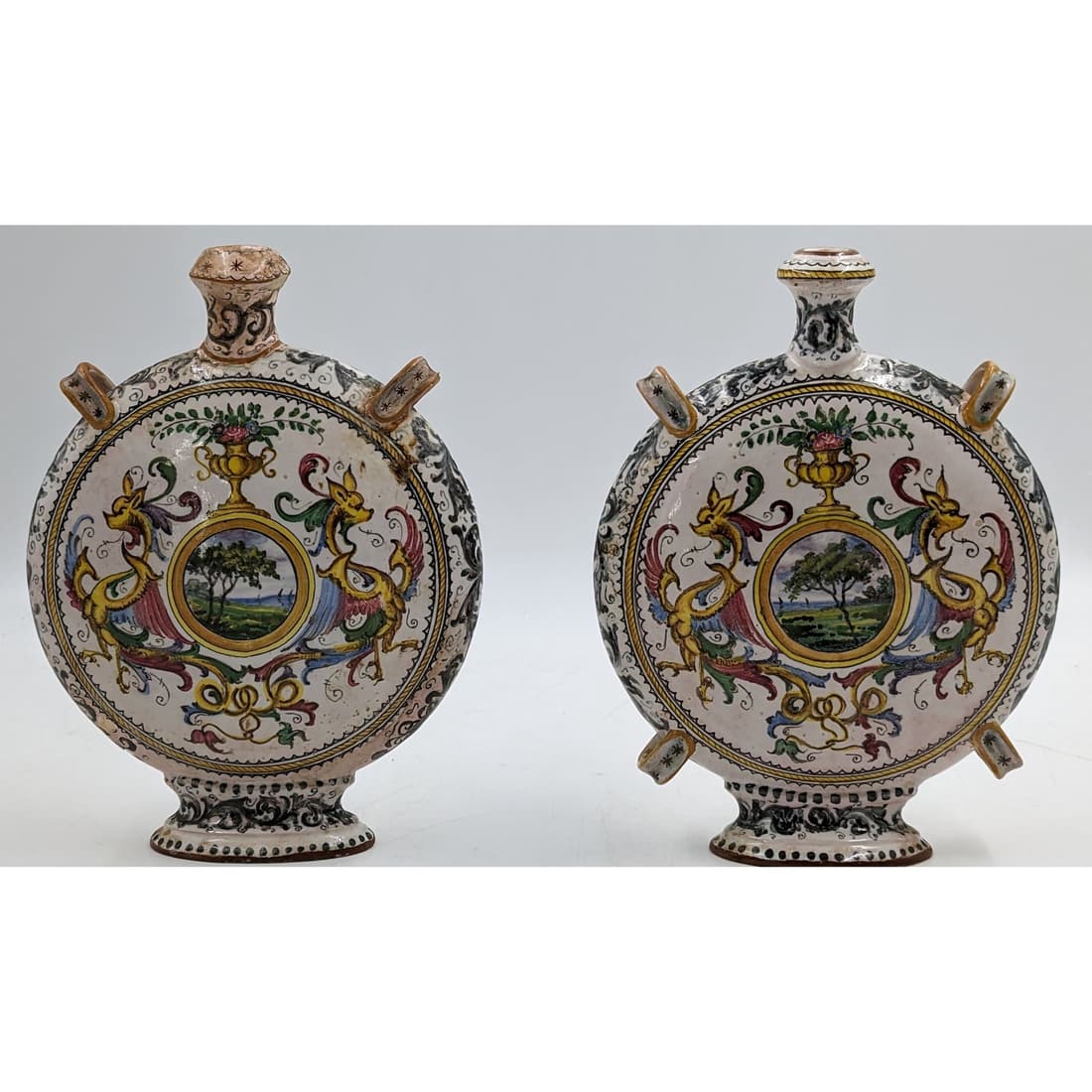 Early Pair Of Faience Flasks, 18th Century: Early Pair Of Faience Flasks, 18th Century. Measures approx. 9 1/2" X 7" each. || Please carefully read our terms of sale, shipping information, and request any condition reports or photos prior to pl