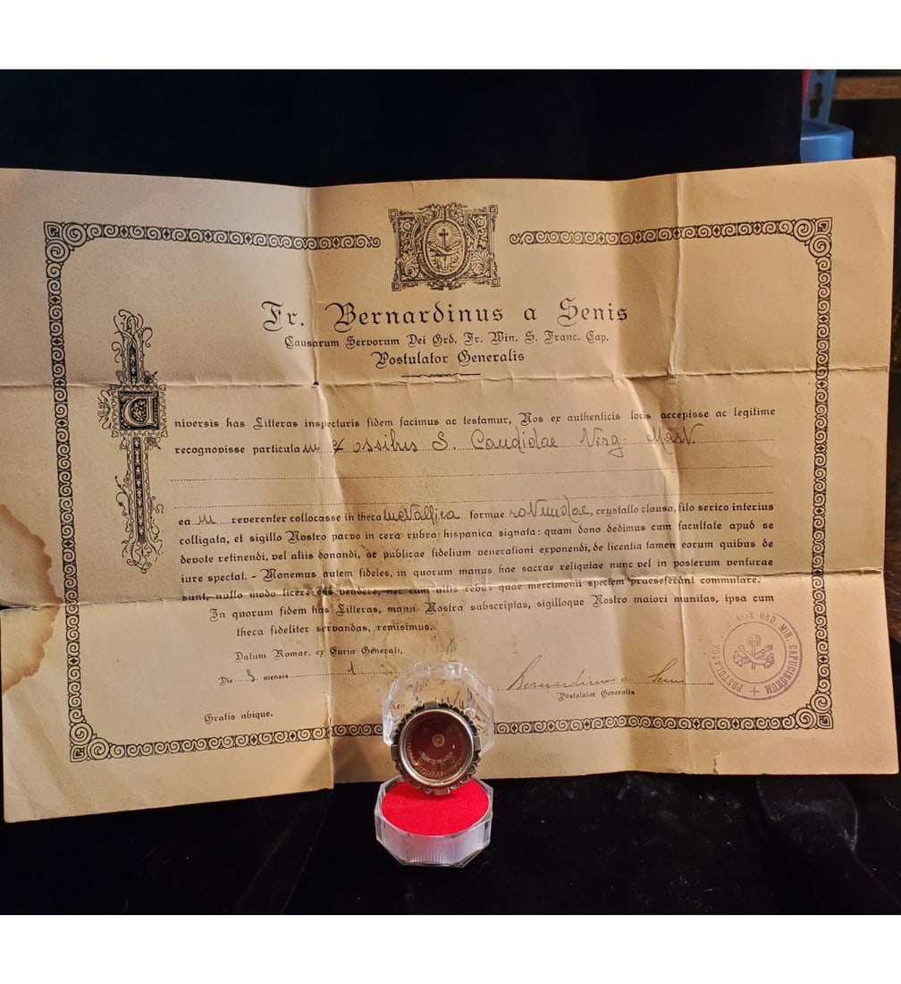 1st class relic of Saint Claudia, Virgin and Martyr with authentication document dated 1955: 1st class relic of Saint Claudia, Virgin and Martyr with authentication document dated 1955. The relic is ex. Ossibus (bone), and contained in a round fancy silver theca. The theca is housed in an acr