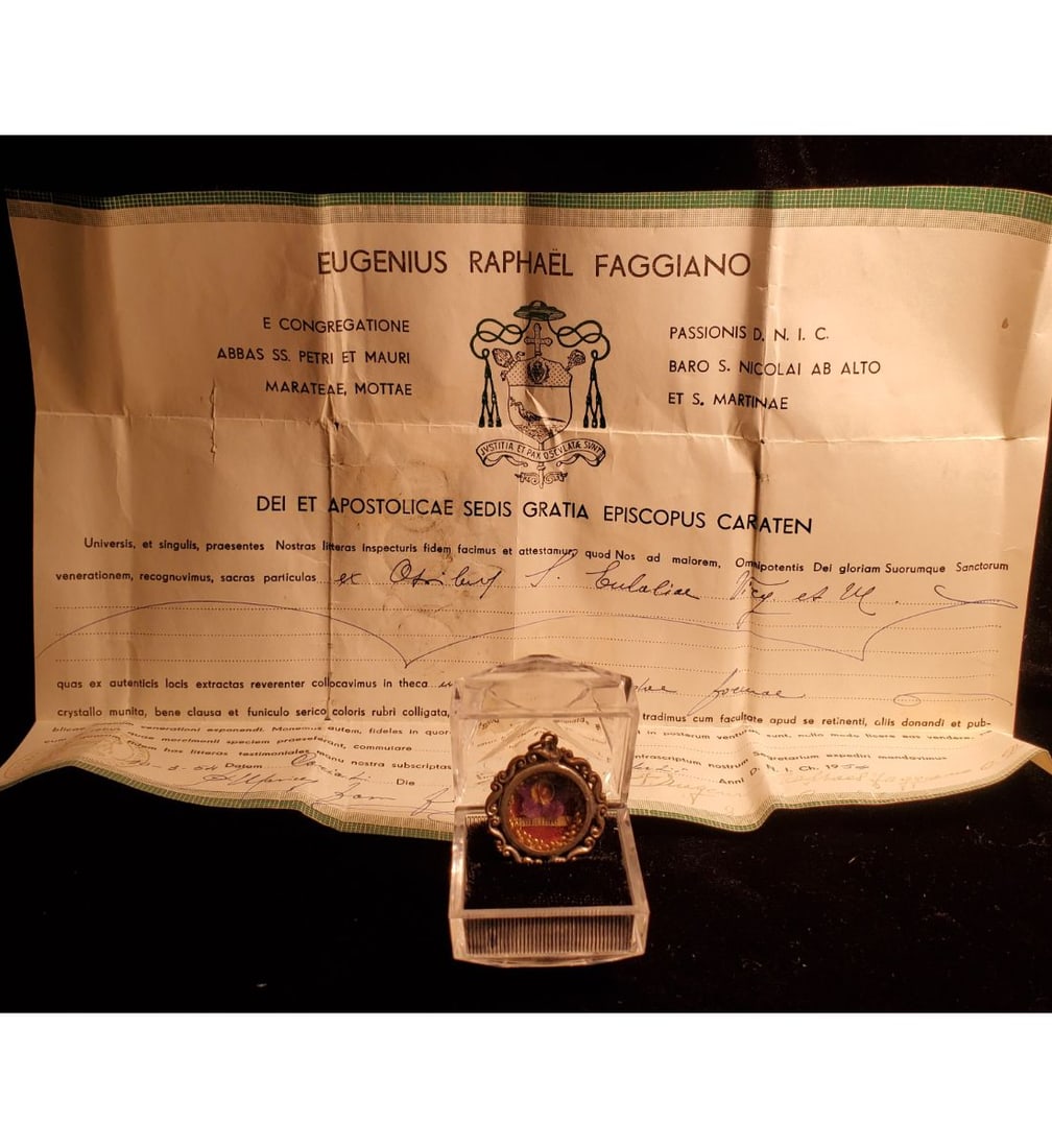 1st class relic of Saint Eulalia, V. M. of Barcelona, 4th Century, with authentication document: 1st class relic of Saint Eulalia, V. M. of Barcelona, 4th Century, with authentication document dated 1954. The relic is ex. ossibus, bone, and contained in a lovely round silver theca. The theca is h
