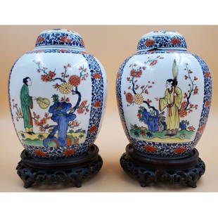 A Pair Of Chinese Export Style Samson Porcelain Ginger Jars, France: A Pair Of Chinese Export Style Samson Porcelain Ginger Jars, France. Without the stands, the jars measure 7" x 7 1/4". With the stands, they stand at 10 3/4". There is a chip and crack on one of the l