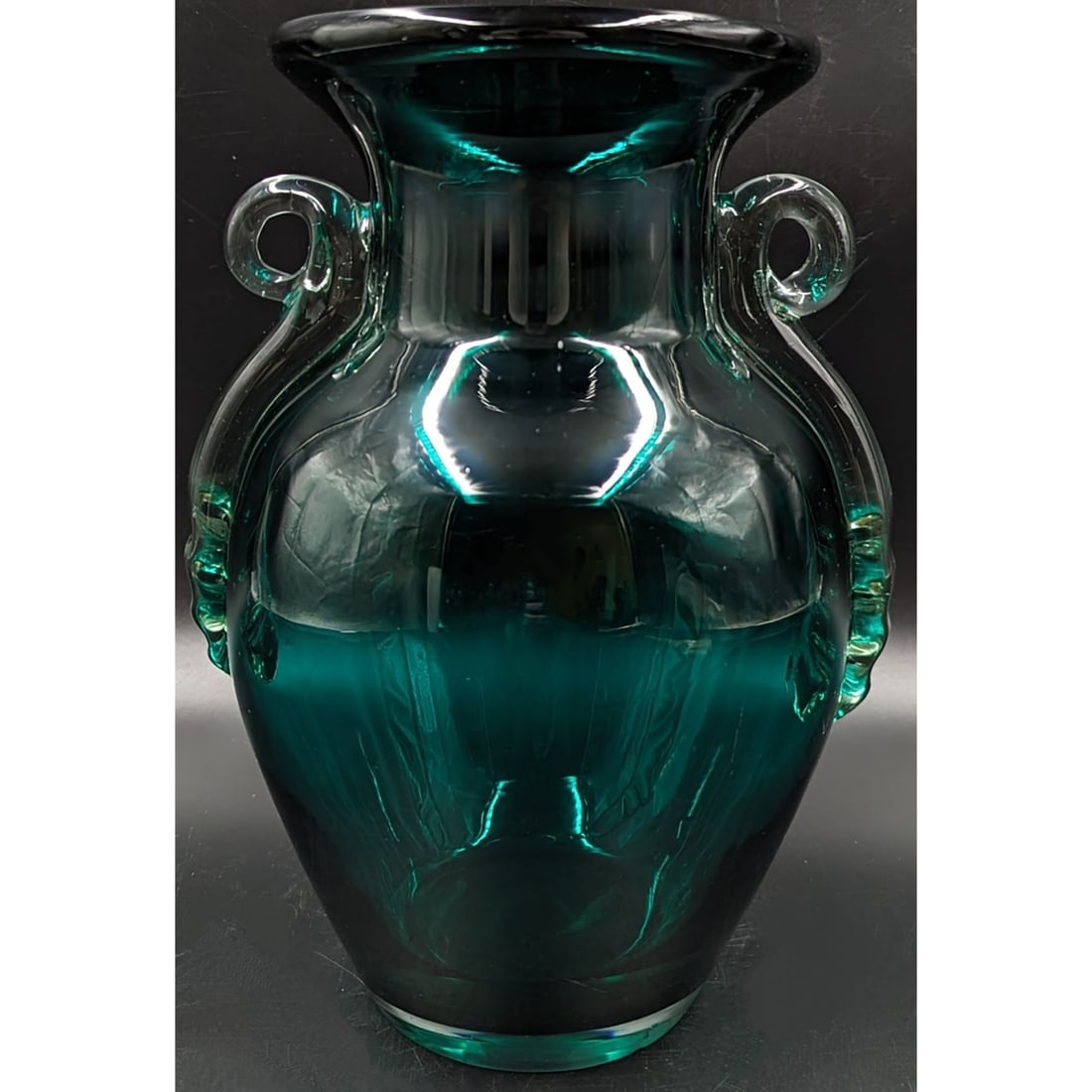 Thick Blenko Emerald Glass Vase With Looped Handles: Thick Blenko Emerald Glass Vase With Looped Handles. Measures approx. 10 1/2" X 8". || Please carefully read our terms of sale, shipping information, and request any condition reports or photos prior 
