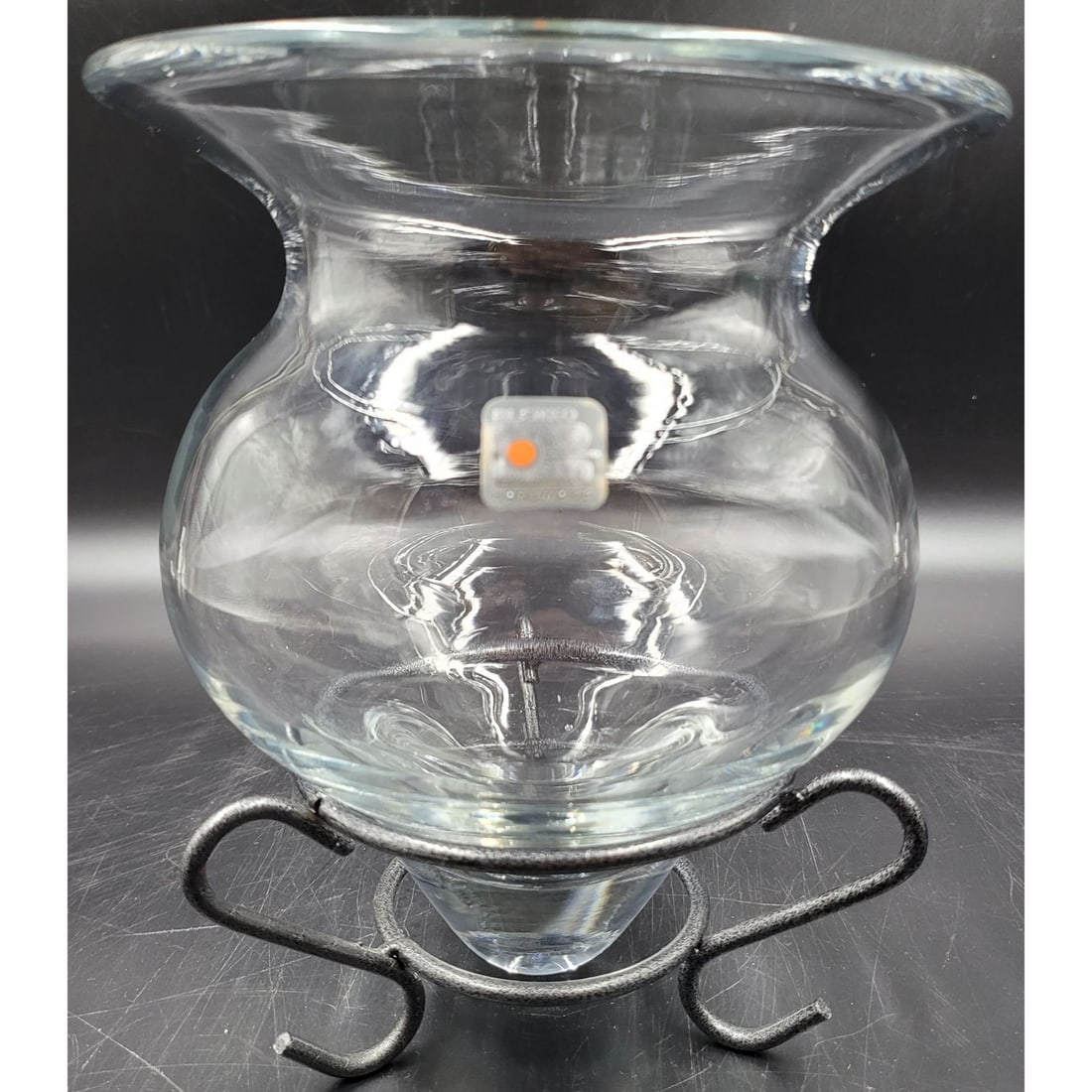 Blenko Clear Glass Vase: Blenko Clear Glass Vase. Appears to once had a base or stand that is no longer included. Stand displayed in pictures is not included. Vase measures 8" X 6.75" || Please carefully read our terms of sal