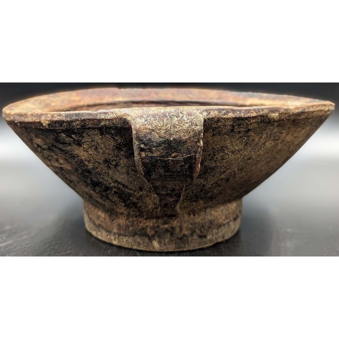 An Antique Polynesian Wood Bowl: An Antique Polynesian Wood Bowl. An old, hand carved bowl, possibly used in the consumption of taro, a starchy, root vegetable from which poi, and other traditional Polynesian consumables are made. Bo