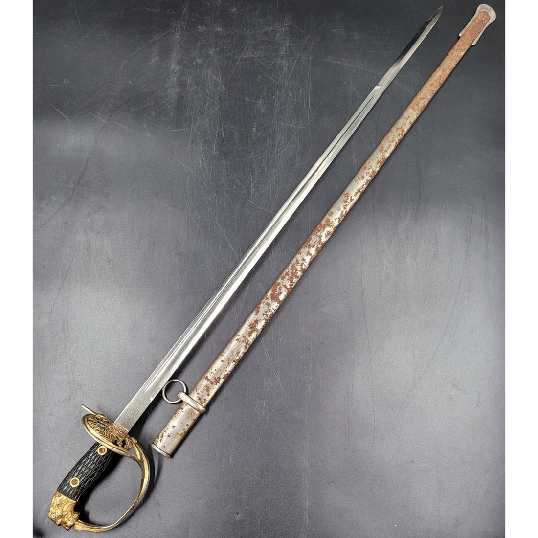 An Early 20th Century Spanish Brass Sword: An Early 20th Century Spanish Brass Sword. Sword measures approx. 36.25" X 5" X 3.5" when in sheath. || Please carefully read our terms of sale, shipping information, and request any condition reports