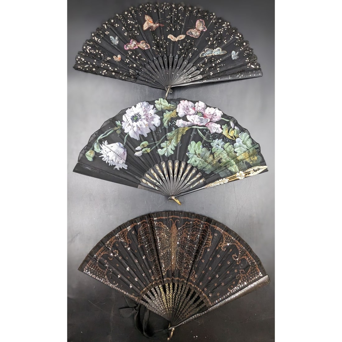 Lot Of 3 Antique Art Nouveau Black Silk Fans With Wooden Handles And Painted Scenes, 1900-1920: Lot Of 3 Antique Art Nouveau Black Silk Fans With Wooden Handles And Painted Scenes, 1900-1920. Measures approx. from 9 1/4" X 16 1/4" to 9 1/2" X 18". || Please carefully read our terms of sale, ship