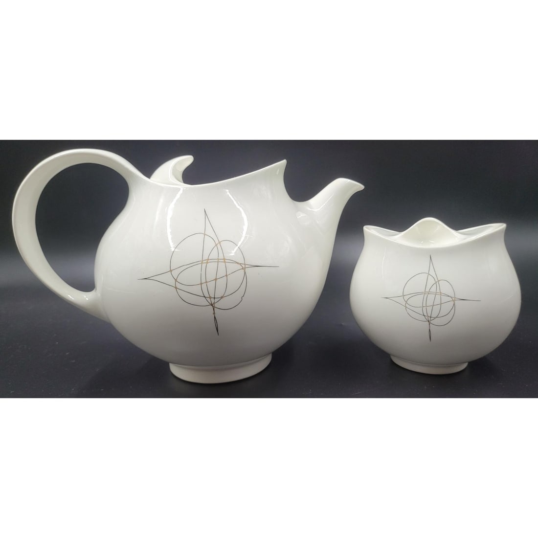 Eva Zeisel Designed Fantasy Hallcraft China: Eva Zeisel Designed Fantasy Hallcraft China. Lot consists of 2 high quality covered pieces, the teapot and sugar bowl. Both pieces in superb condition. Pieces measure from 6" X 9" X 6" to 3.5" X 4" X
