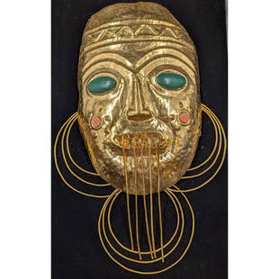 A Tribal Gold Metal Alloy Mask With Jade And Shell Inlay: A Tribal Gold Metal Alloy Mask With Jade And Shell Inlay. Measures approx. 16" X 10"|| Please carefully read our terms of sale, shipping information, and request any condition reports or photos prior