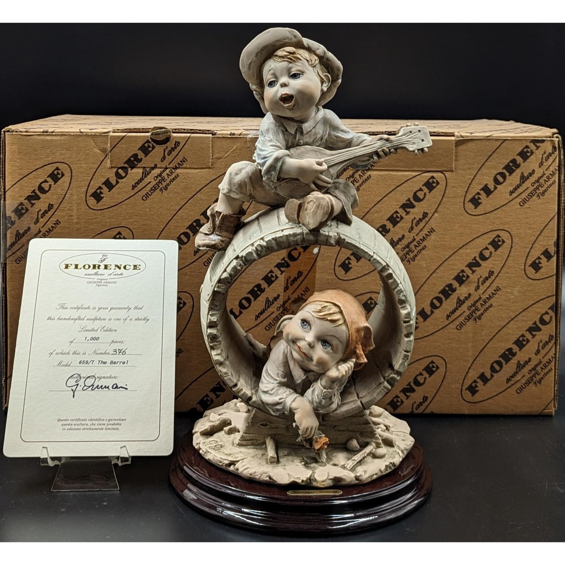 Giuseppe Armani Figurine: Limited Ed. 376 / 1000 "The Barrel" 659T With COA And Original Box: Giuseppe Armani Figurine: Collector's Society 1991 "Little Pierrot With Daisies" 745E With Box, Ink Signed On Piece. Measures approx. 9" X 4 1/4" X 6". || Please carefully read our terms of sale, ship