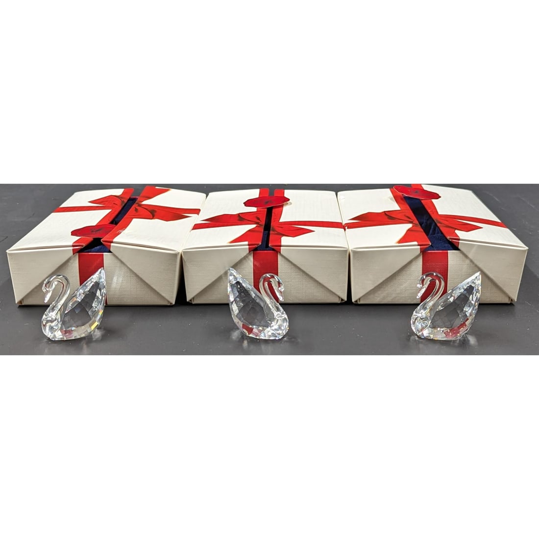 Lot Of 3 Swarovski Miniature Crystal Swans In Original Boxes: Lot Of 3 Swarovski Miniature Crystal Swans In Original Boxes. || Please carefully read our terms of sale, shipping information, and request any condition reports or photos prior to placing a bid. Any 