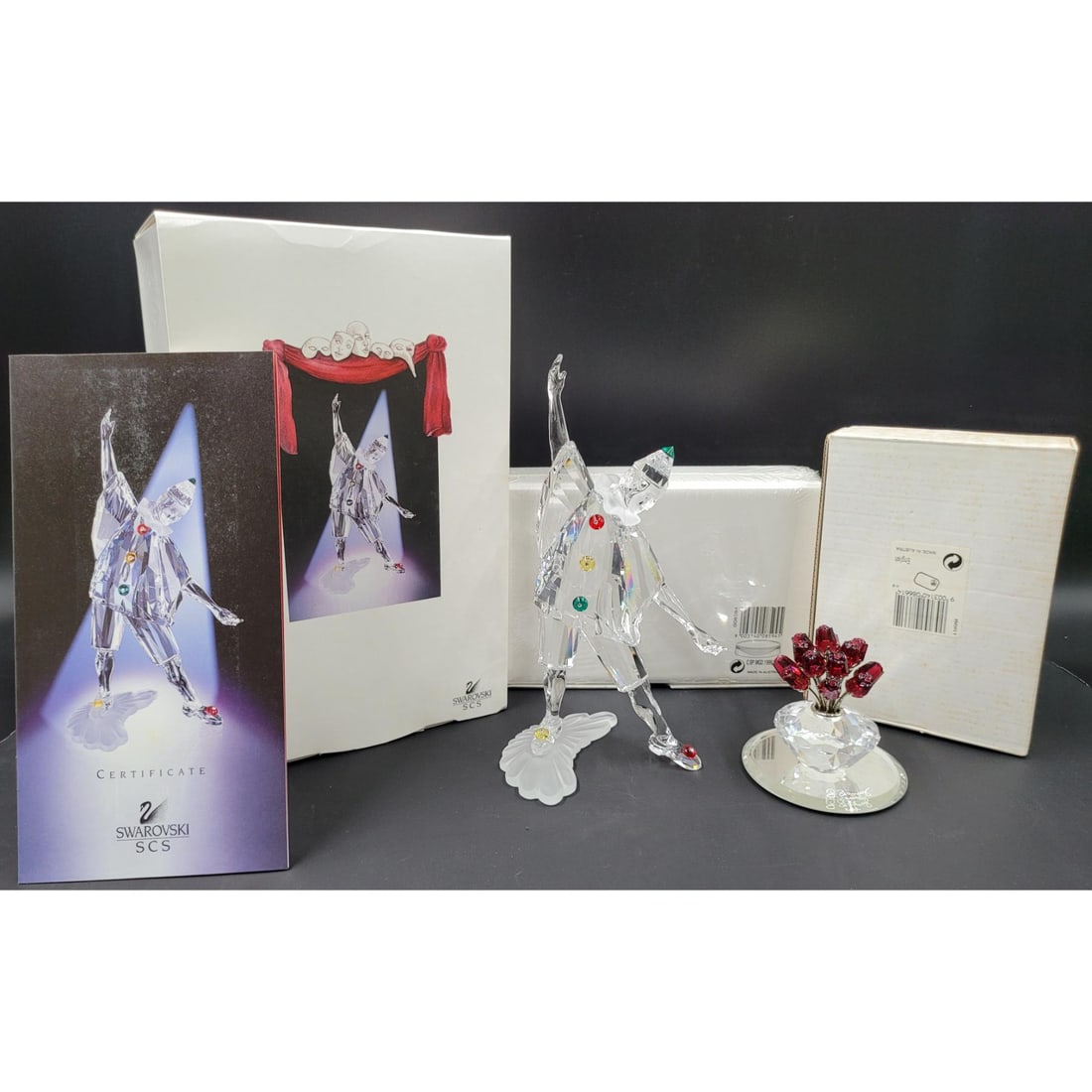 Swarovski SCS Pierrot Figurine & Plaque With Original Case And COA, With Vase Of Roses: Swarovski SCS Pierrot Figurine & Plaque With Original Case And COA, With Vase Of Roses. Has Been previously repaired. Measures approx. 8" X 4" X 3.5" || Please carefully read our terms of sale, shippi