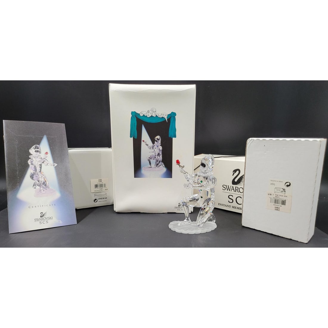 Swarovski SCS Harlequin Figurine & Plaque With Original Case And COA, With Welcome Gift: Swarovski SCS Harlequin Figurine & Plaque With Original Case And COA, With Welcome Gift. Has Been previously repaired. Measures approx. 5" X 3.75" X 2.5" || Please carefully read our terms of sale, sh