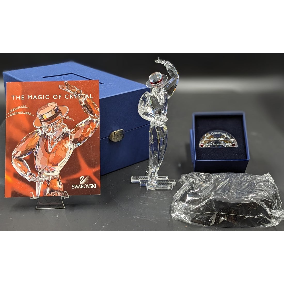 Swarovski SCS Antonio Figurine & Plaque With Original Case And COA: Swarovski SCS Antonio Figurine & Plaque With Original Case And COA, With Vase Of Red Roses Figurine. Measures approx. 8.5" X 3" X 2.5". || Please carefully read our terms of sale, shipping information