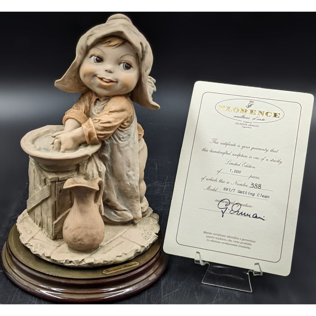 Giuseppe Armani Figurine: Limited Ed. 388/1000 "Getting Clean" 611-T With Original Box And COA: Giuseppe Armani Figurine: Limited Ed. 388/1000 "Getting Clean" 611-T With Original Box And COA. Measures approx. 8 1/2" X 6". Please note you can choose not to keep the box, as there is a lot of wear 