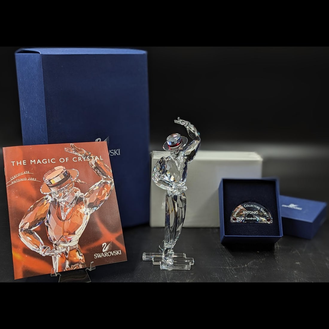 Swarovski SCS Antonio Figurine & Plaque With Original Case And COA: Swarovski SCS Antonio Figurine & Plaque With Original Case And COA. Measures approx. 8.5" X 3" X 2.5". BOX SIZE IS NOT INCLUDED. || Please carefully read our terms of sale, shipping information, and r
