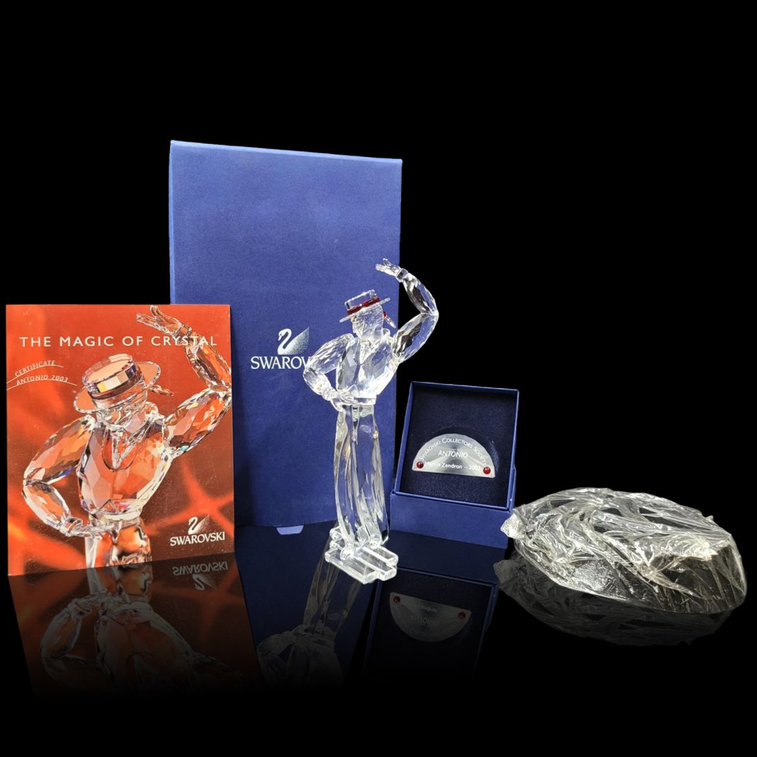 Swarovski SCS Antonio Figurine & Plaque With Original Case And COA: Swarovski SCS Antonio Figurine & Plaque With Original Case And COA. Measures approx. 8.5" X 3" X 2.5". || Please carefully read our terms of sale, shipping information, and request any condition repor
