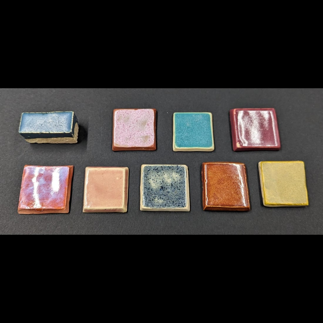 Lot Of 9 University Of North Dakota School Of Mines Trial Glaze Tiles: University Of North Dakota School Of Mines, Lot Of Nine Trial Glaze Tile. 8 Of These Tiles Are Roughly 1-1/4" Square, All With Some Base Und Identification. Rectangular Deep Blue Is From A Later Era A