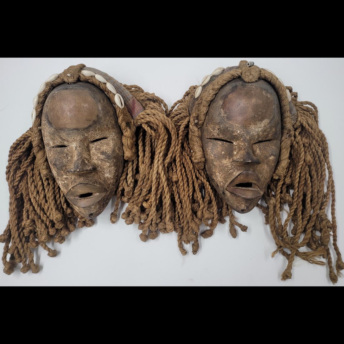 Pair Of Antique Carved Wood African Masks: Pair Of Antique Carved Wood African Masks. 14" X 13" each || >>>RBFineArts CFL Inc. Shipping, Payment & Auction Policies<<< !!!DUE TO A RECENT INCREASE IN FRAUDULENT ACTIVITIES FROM BUYERS IN OUR AUCT