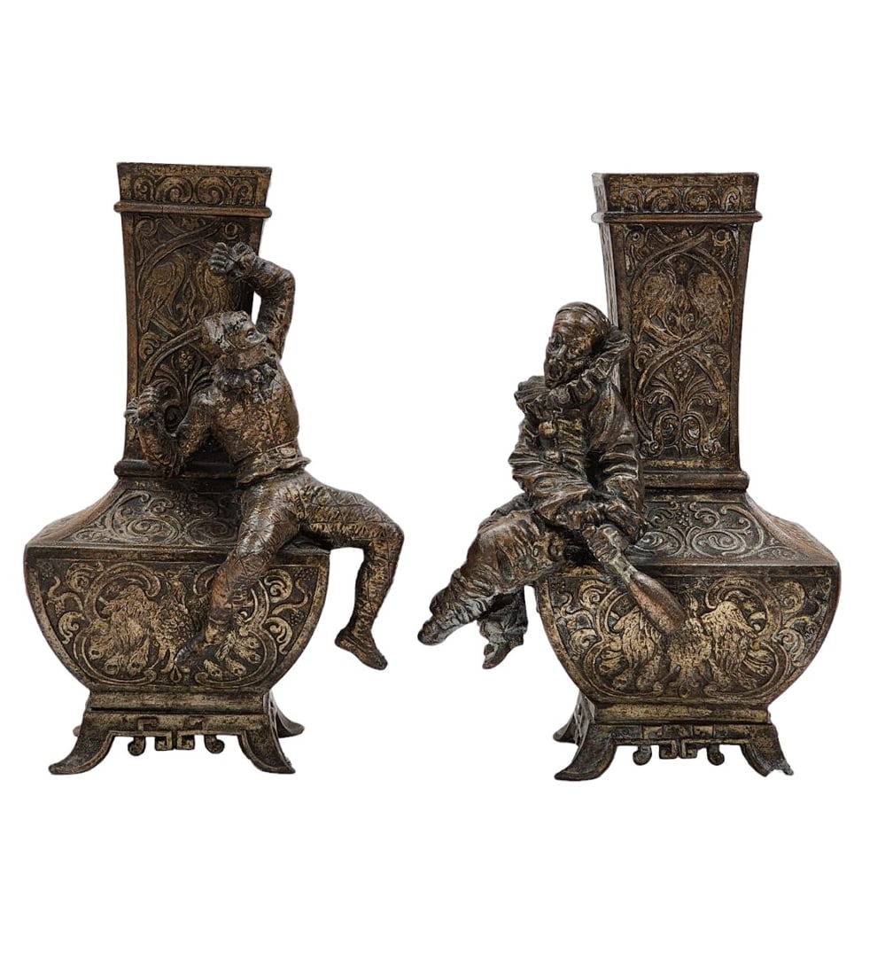A pair Of European Spelter Vases Decorated With Eagles & Drinking Jesters: A pair Of European Spelter Vases Decorated With Eagles & Drinking Jesters. Measure 8 5/8" Tall. A Very Small Piece Is Missing On One Of The Vases leg. Provenance: Private Collection From A Florida Est