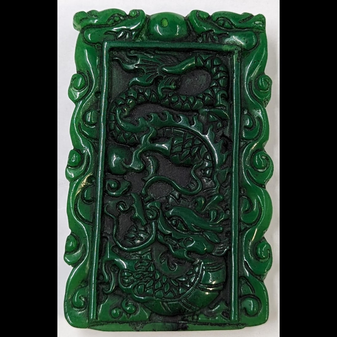 Finely Carved Apple Green Jadeite Dragon And Phoenix Plaque: Finely Carved Apple Green Jadeite Dragon And Phoenix Plaque . Measures approx. 3 1/2" X 2 1/4". Please copy and paste the URL link below to review our Terms and Conditions for bidding, paym