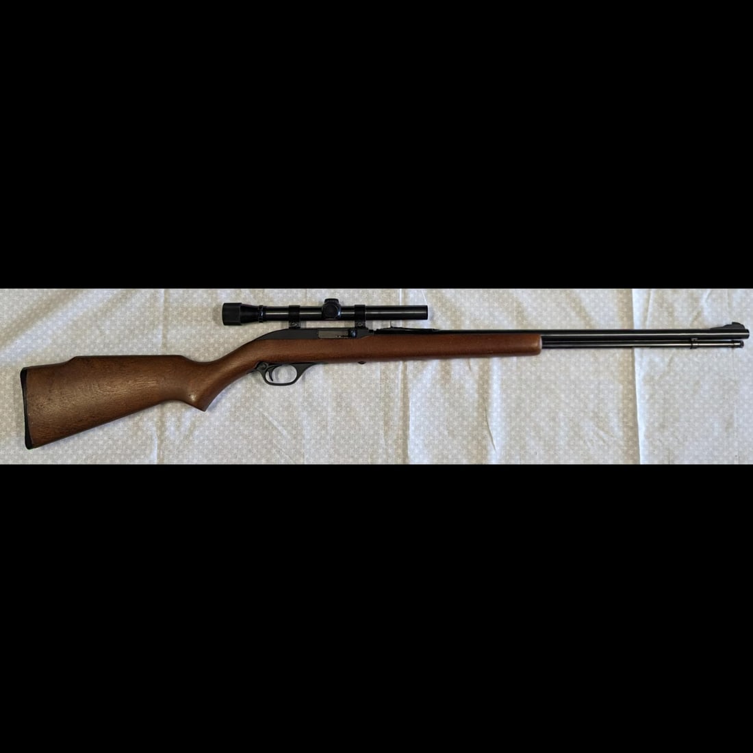 Marlin Model 60 Cal .22L Rimfire Rifle, Serial Number 17372260, With Original Hard Case: *** DUE TO THIS LOT BEING CLASSED AS A FIREARM IT MUST BE PAID VIA BANK WIRE TRANSFER OR CERTIFIED CHECK*** Marlin Model 60 Cal .22L Rimfire Rifle, Serial Number 17372260, With Original Hard Case. Mea