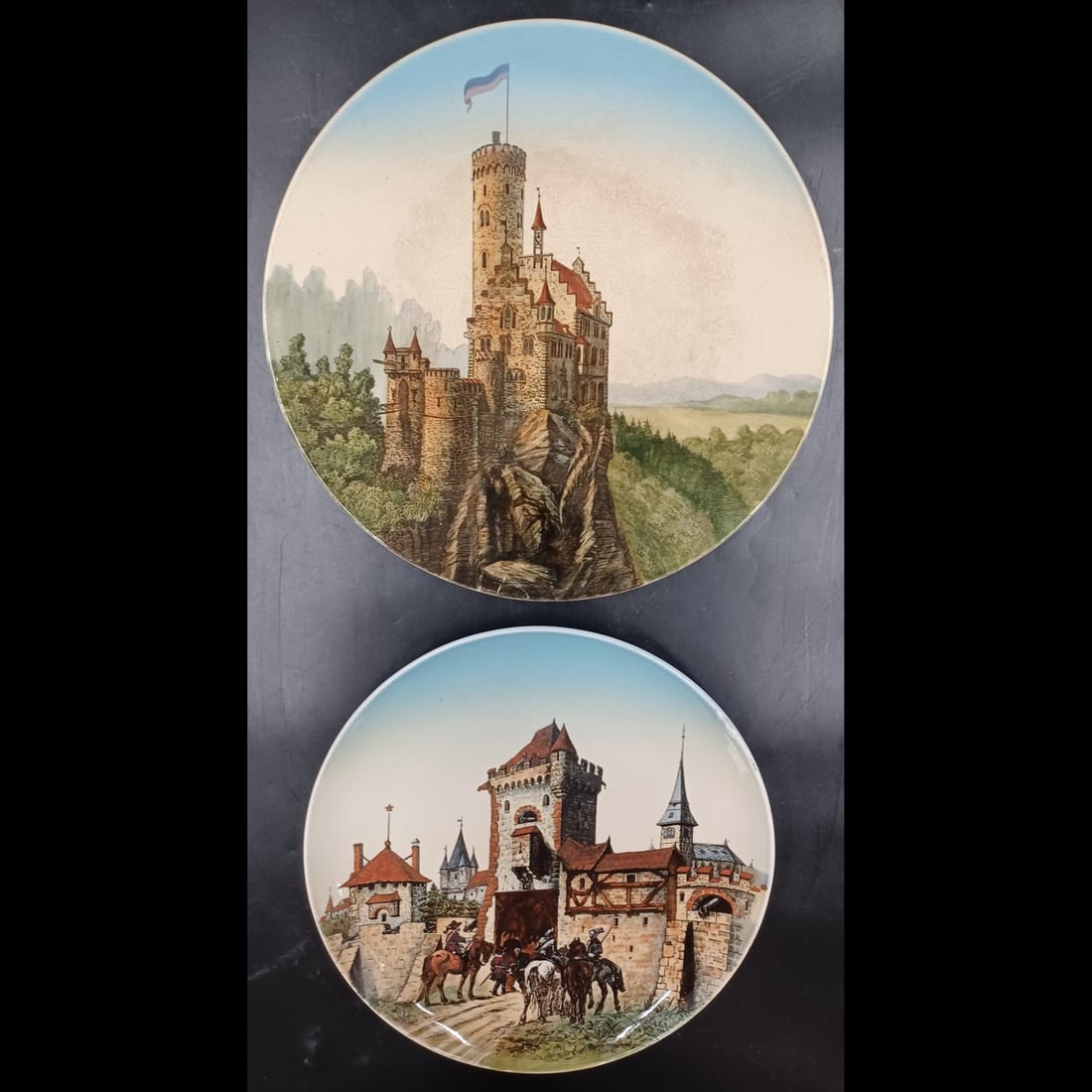 Pair Of Villeroy & Boch Mettlach Charger Plates: Pair Of Villeroy & Boch Mettlach Charger Plates. Measures approximately 12-1/4" (Stadtthor Esslingen) and 13-3/4" (Lichtenstein Castle). Please copy and paste the URL link below to review our