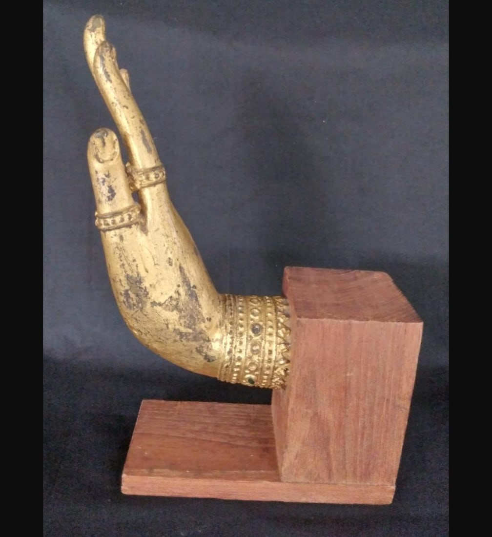 A Gilt Painted Bronze Buddha Hand Thai 16-17th Century: A Gilt Painted Bronze Buddha Hand Thai 16-17th Century. Measure 21 Cm. Provenance: Private Estate Central Florida. Please copy and paste the URL link below to review our Terms and Conditions