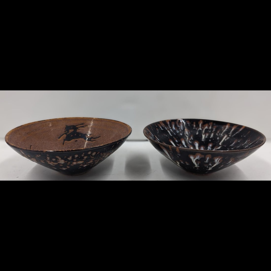 Pair Of Chinese Jizhou Kiln Black Glazed Bowls: Pair Of Chinese Jizhou Kiln Black Glazed Bowls. Measures approx. 2 1/4" X 6" each. Please copy and paste the URL link below to review our Terms and Conditions for bidding, payment, shipping a