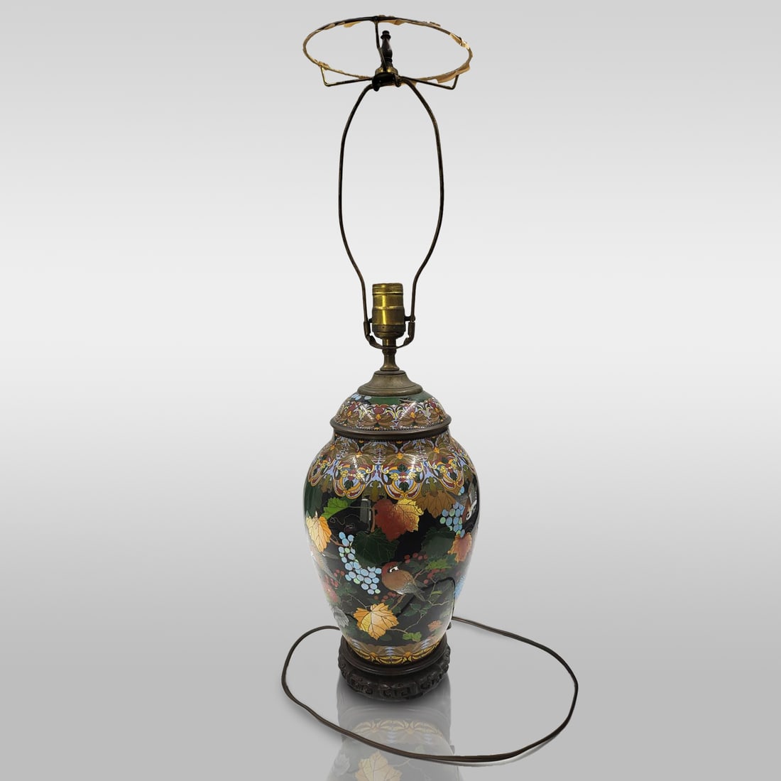 Antique Asian Cloisonné Lamp On Wood Carved Base: Antique Asian Cloisonné Lamp On Wood Carved Base. Measures approximately 8" x 25" Please copy and paste the URL link below to review our Terms and Conditions for bidding, payment, shipping an