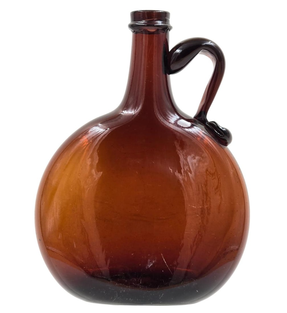Hand Blown Amber Glass Bottle / Flask OPEN PONTIL AND APPLIED HANDLE: Hand Blown Amber Glass Bottle / Flask OPEN PONTIL AND APPLIED HANDLE. Measure 8" Tall. Provenance: Private Central Florida Estate. Please copy and paste the URL link below to review our Term