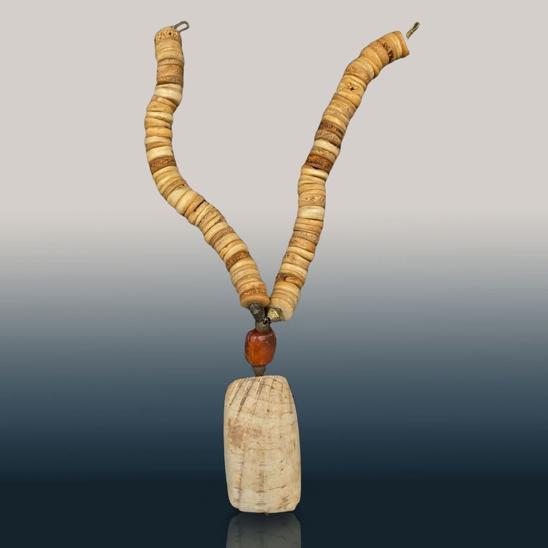 An Antique Carved Bone, Amber, And Brass Necklace, Likely Of African Origin: ***DUE TO THIS LOT BEING JEWELRY IT MUST BE PAID VIA BANK WIRE TRANSFER OR CERTIFIED CHECK*** An Antique Carved Bone, Amber, And Brass Necklace, Likely Of African Origin. Measures approx. 17" long unc