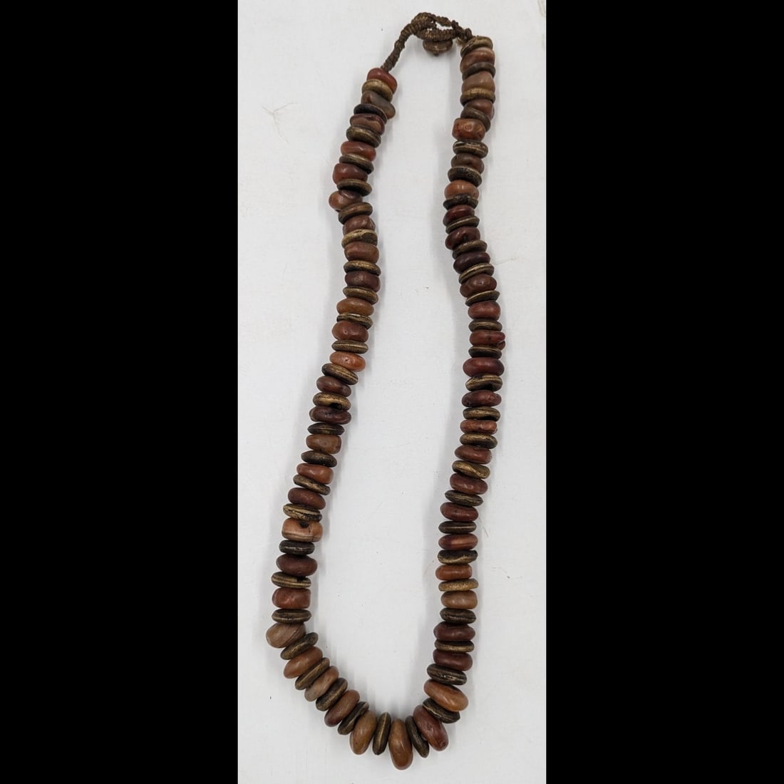 A Large Antique African Carved Bone And Carnelian Necklace: **DUE TO THIS LOT BEING JEWELRY IT MUST BE PAID VIA BANK WIRE TRANSFER OR CERTIFIED CHECK.** A Large Antique African Carved Bone And Carnelian Necklace. Measures approx. 15 1/2" clasped. Provenance: P