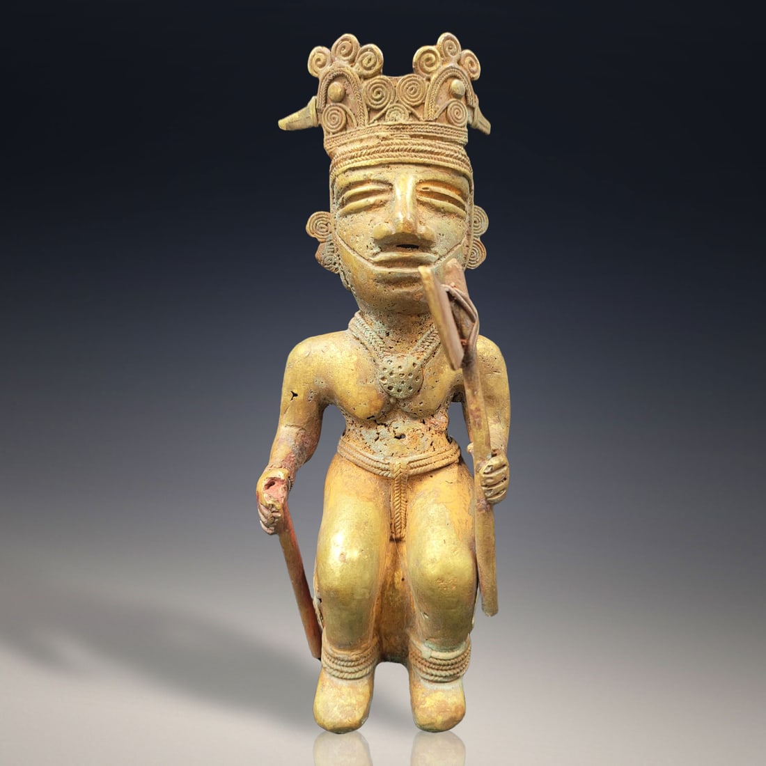 An Extra Large Tairona Seated Axe Shaman Figure: An Extra Large Tairona Seated Axe Shaman Figure. Measures approx. 8" X 3" X 3" Please copy and paste the URL link below to review our Terms and Conditions for bidding, payment, shipping an