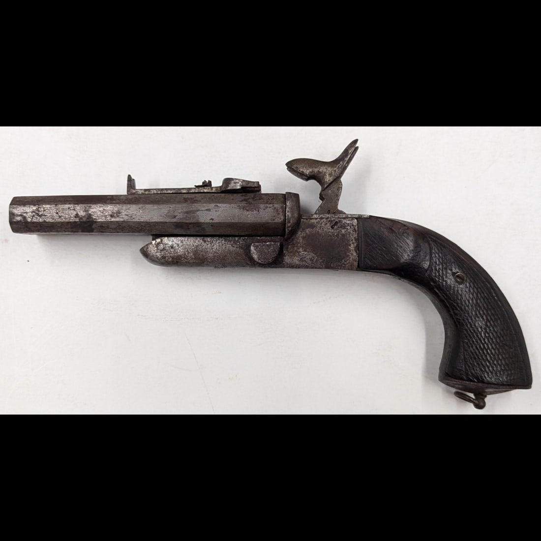 Antique Double Barrel Pinfire .54Cal Pistol, Likely Civil War Era: ***DUE TO THIS LOT BEING CLASSED AS A FIREARM IT MUST BE PAID VIA BANK WIRE TRANSFER OR CERTIFIED CHECK.*** Antique Double Barrel Pinfire .54Cal Pistol, Likely Civil War Era. Measures approx. 10 1/2" 
