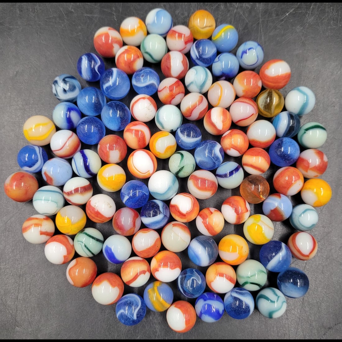 A Large Lot Of Antique Pettier Rainbow Marbles: A Large Lot Of Antique Pettier Rainbow Marbles. Please copy and paste the URL link below to review our Terms and Conditions for bidding, payment, shipping and other specifics for the auctio