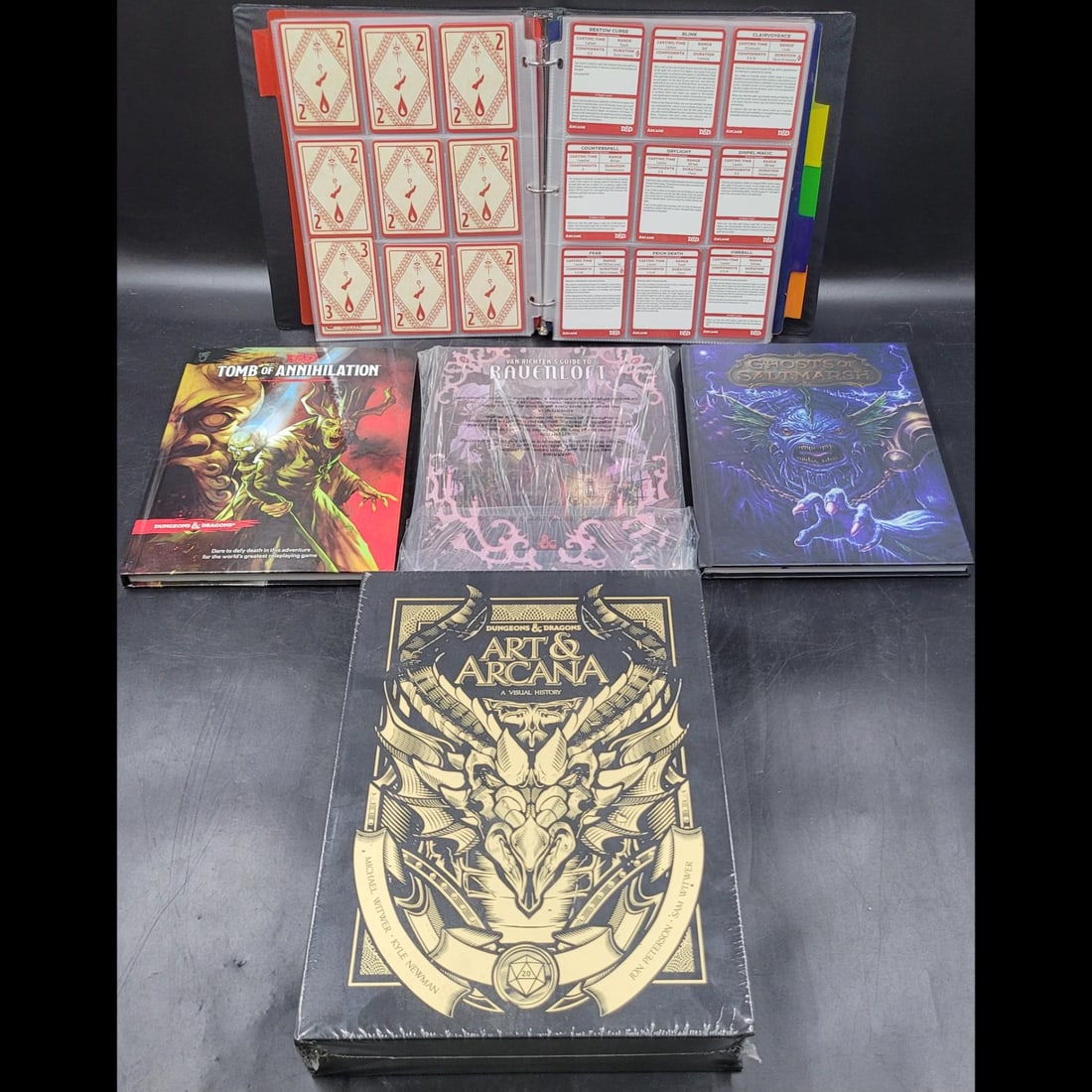 Lot Of 5 Dungeons And Dragons D&D 5e Books AND Collectables: Lot Of 5 Dungeons And Dragons D&D 5e Books AND Collectables. Includes Ghosts Of Saltmarsh, Van Richten's Guide To Ravenloft, Tomb Of Annihilation, Art And Arcana A Visual History, and Collectable Spel