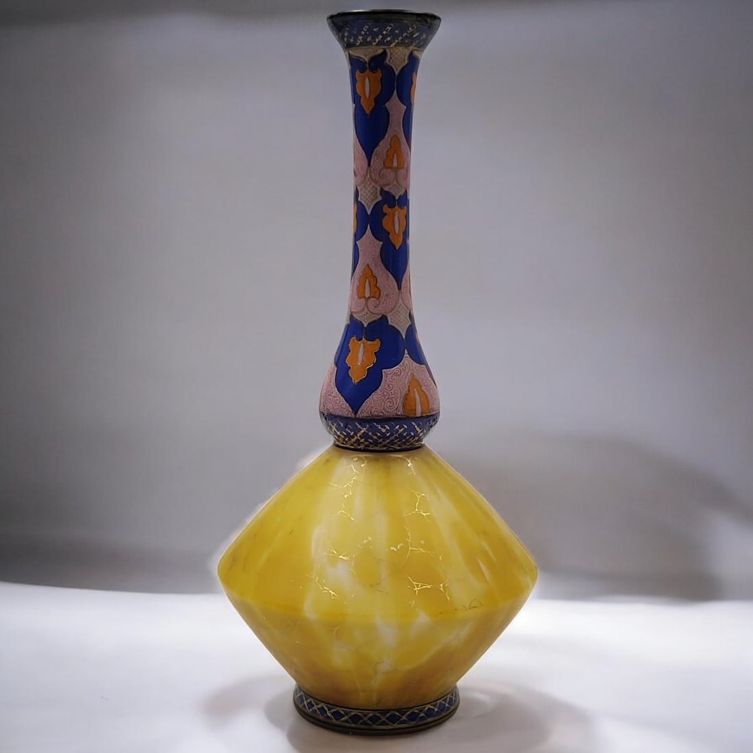 Kralik Harrach Czech Bohemian Art Nouveau Enamel Art Glass Bud Vase: Kralik Harrach Czech Bohemian Art Nouveau Enamel Art Glass Bud Vase. Measures approximately 10" x 5". Upper stem is a Moorish design with the base in yellow and white drip, highlighted with gold latti