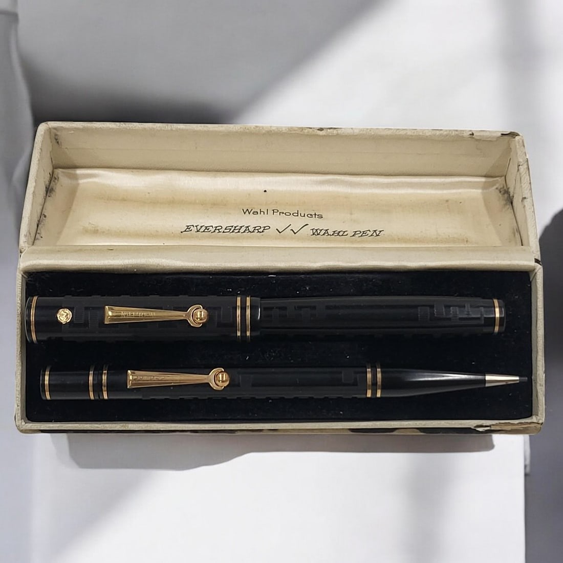 Wahl Fountain Pen & Pencil Set No. 74: Wahl Fountain Pen & Pencil Set No. 74. Black chased hard rubber circa 1927. Fully operating with roller ball clips. Monogrammed on the top of each gold cap disk, "AMM." Gold seal on fountain pen. Orig