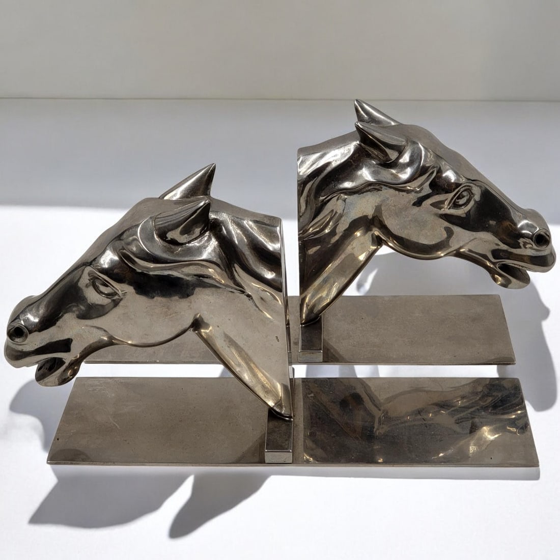 A Very Nice Pair Of Art Deco Silver Plated Equine Bookends: A Very Nice Pair Of Art Deco Silver Plated Equine Bookends. Has some scratches on the flat sheets. Each measures approximately 10-1/4" x 6" Please copy and paste the URL link below to review