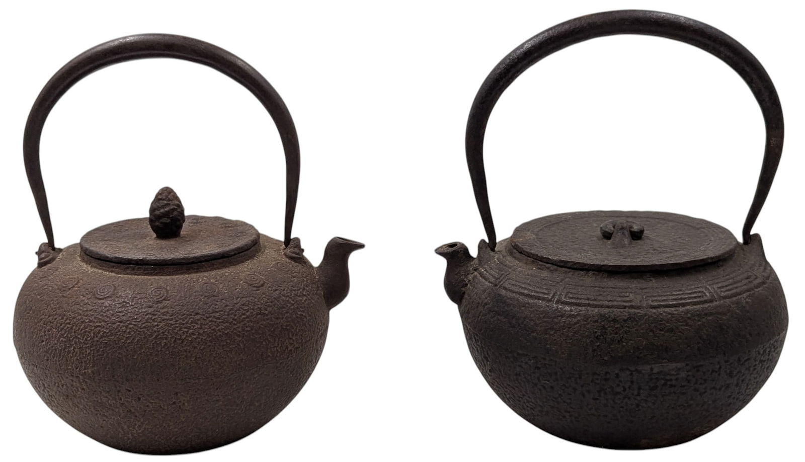 Pair Of Antique Japanese Cast Iron Tea Kettles: Pair Of Antique Japanese Cast Iron Tea Kettles. Measures approx. 8 1/2" X 7 1/2". Please copy and paste the URL link below to review our Terms and Conditions for bidding, payment, shipping an