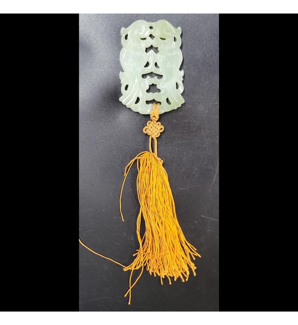 An Antique Chinese Jade Pendant: An Antique Chinese Jade Pendant. Provenance: Central Florida Collectors Estate whom had lived in Japan for many years. Measures approximately 2-1/4" x 1-1/2" Please copy and paste the URL li