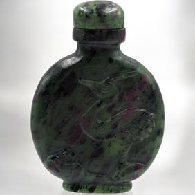 A Finely Carved Zoisite Snuff Bottle