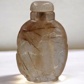 A Finely Carved Quartz Snuff Bottle