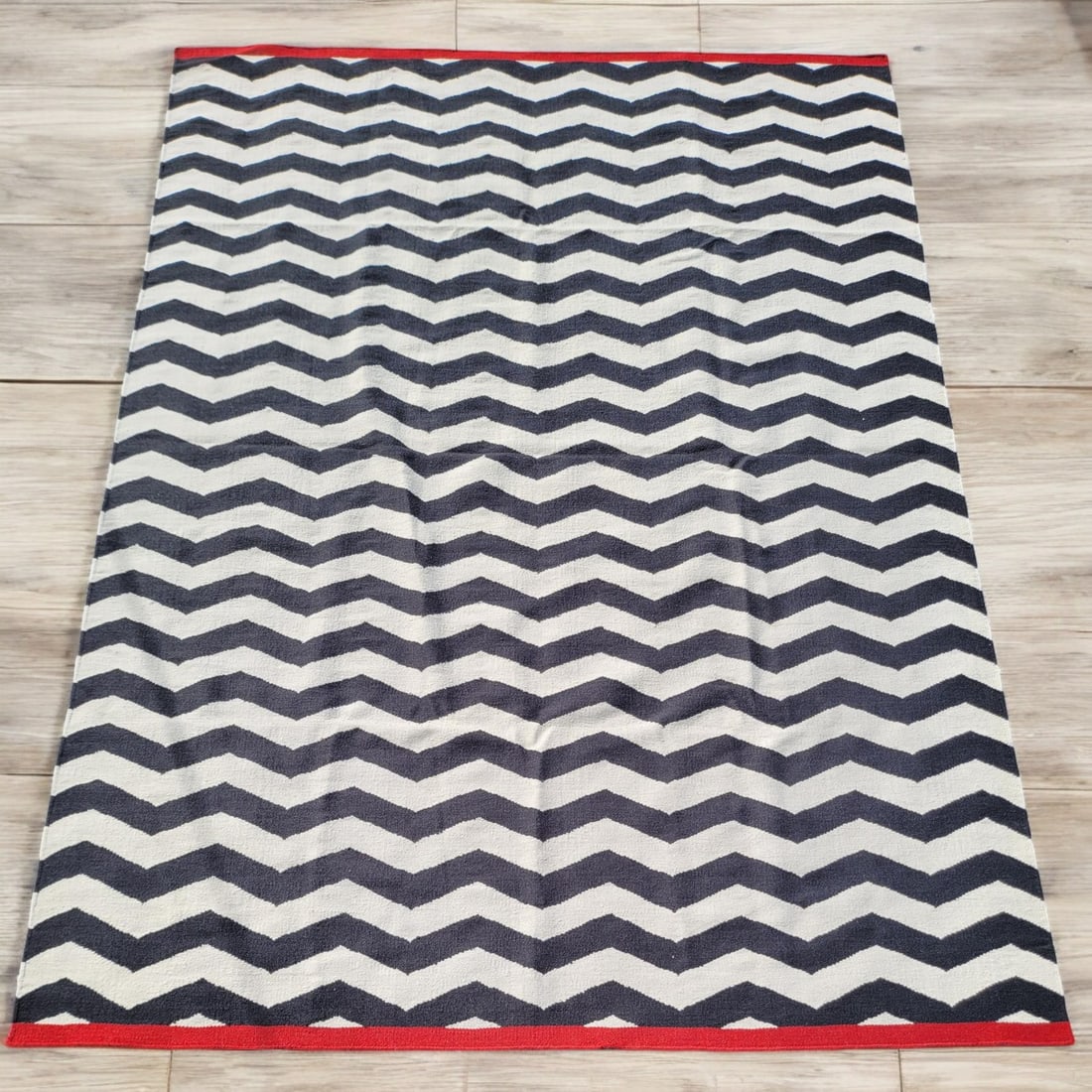 West Elm Zig Zag Area Rug: West Elm Zig Zag Area Rug. Measures approx. 9ft X 12ft Please copy and paste the URL link below to review our Terms and Conditions for bidding, payment, shipping and other specifics for th