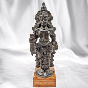 An Antique Bronze Statue Of An Indian Deity, Possibly Vishnu, On A Wooden Stand