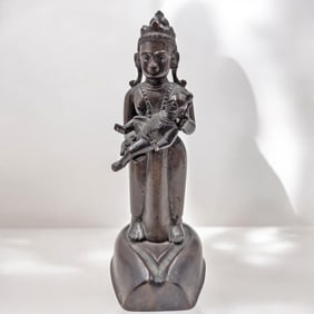 An Antique Bronze Statue Of Hindu Goddess Tara Holding The Baby Shiva