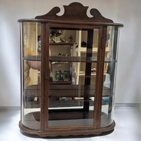 Vintage Curio Cabinet With Curved Glass And A Mirrored Backing